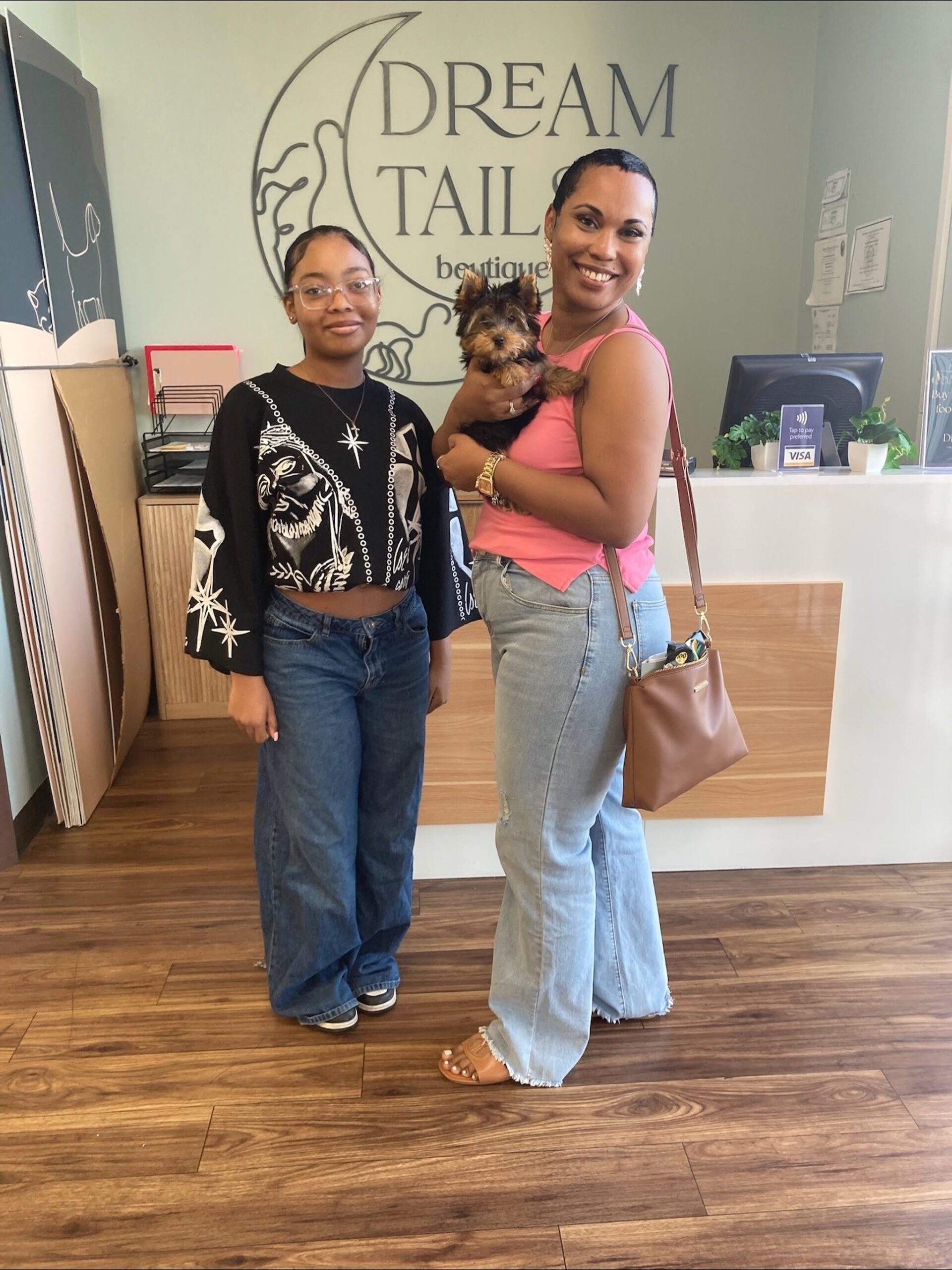 Family meeting a puppy at Dream Tails Henderson